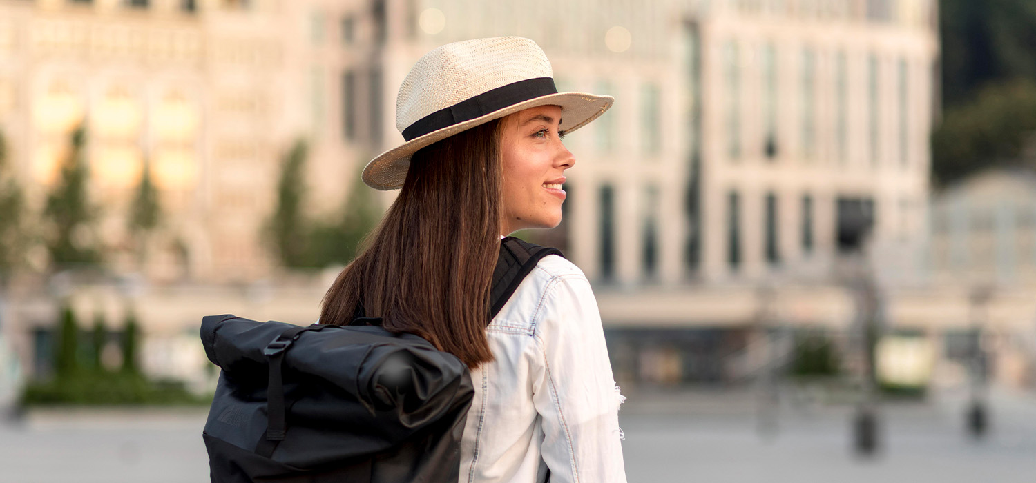 A young girl with a backpack ready to explore.